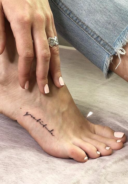 Tatuaggio Tattoo Piedi Scritta